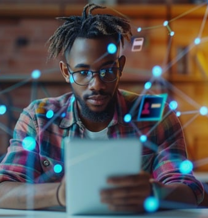 Person at desk looking at tablet computer