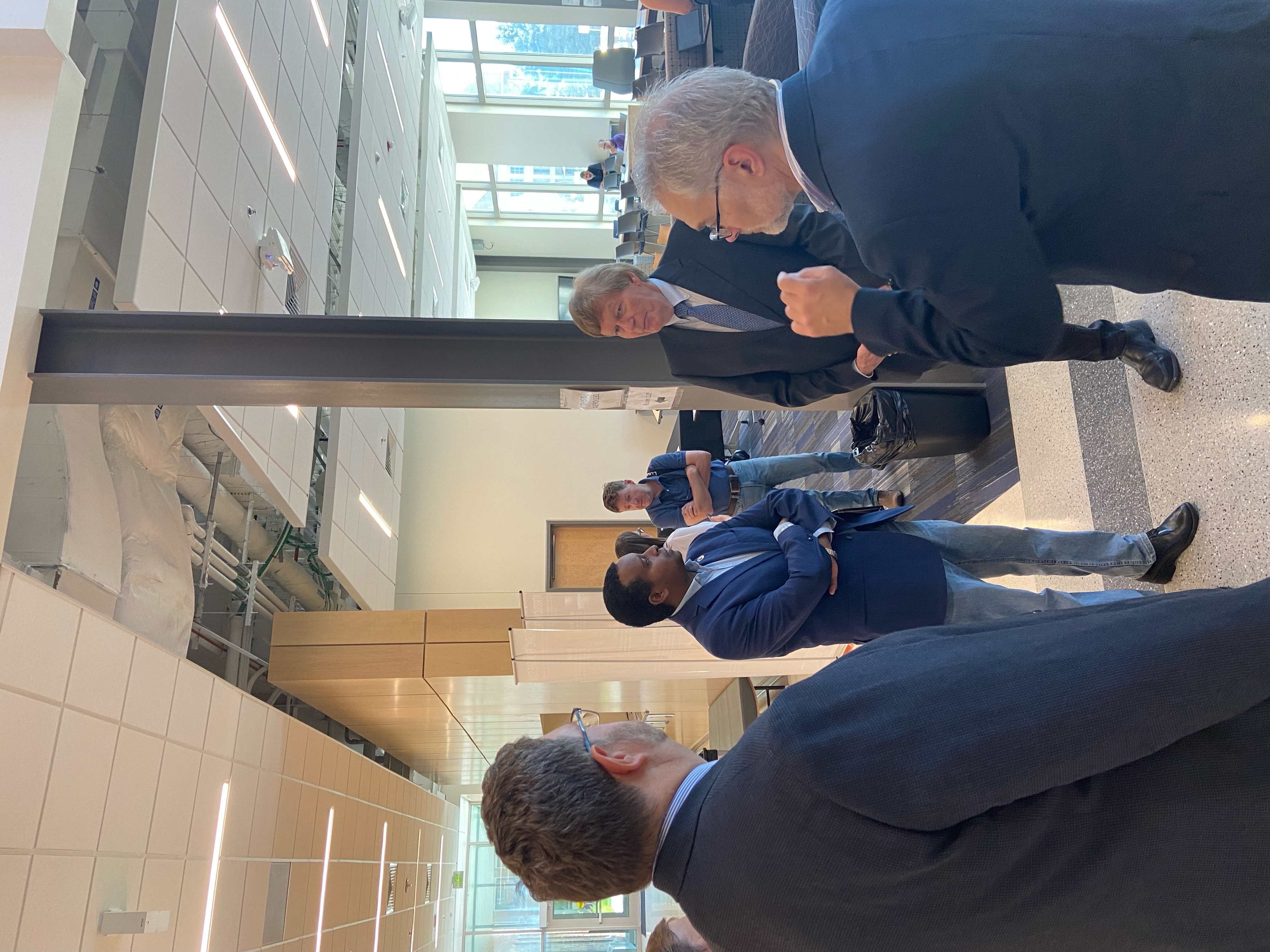 Rep. Joe Neguse (D-CO) speaking with LASP Director Dan Baker at the LASP/NASA Space Act Agreement signing event